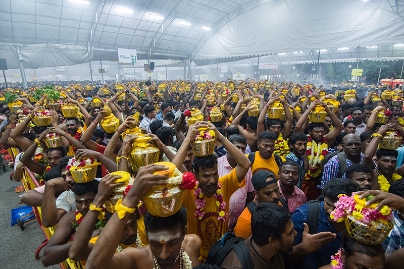 Paal kudam or milk pot bearers usually make up the bulk of devotees undertaking the Thaipusam procession. Here, devotees are seen waiting to commence the procession at the Sri Srinivasa Perumal Temple on Serangoon Road, 2015. Photo by T. Kavindran. Courtesy of Hindu Endowments Board.